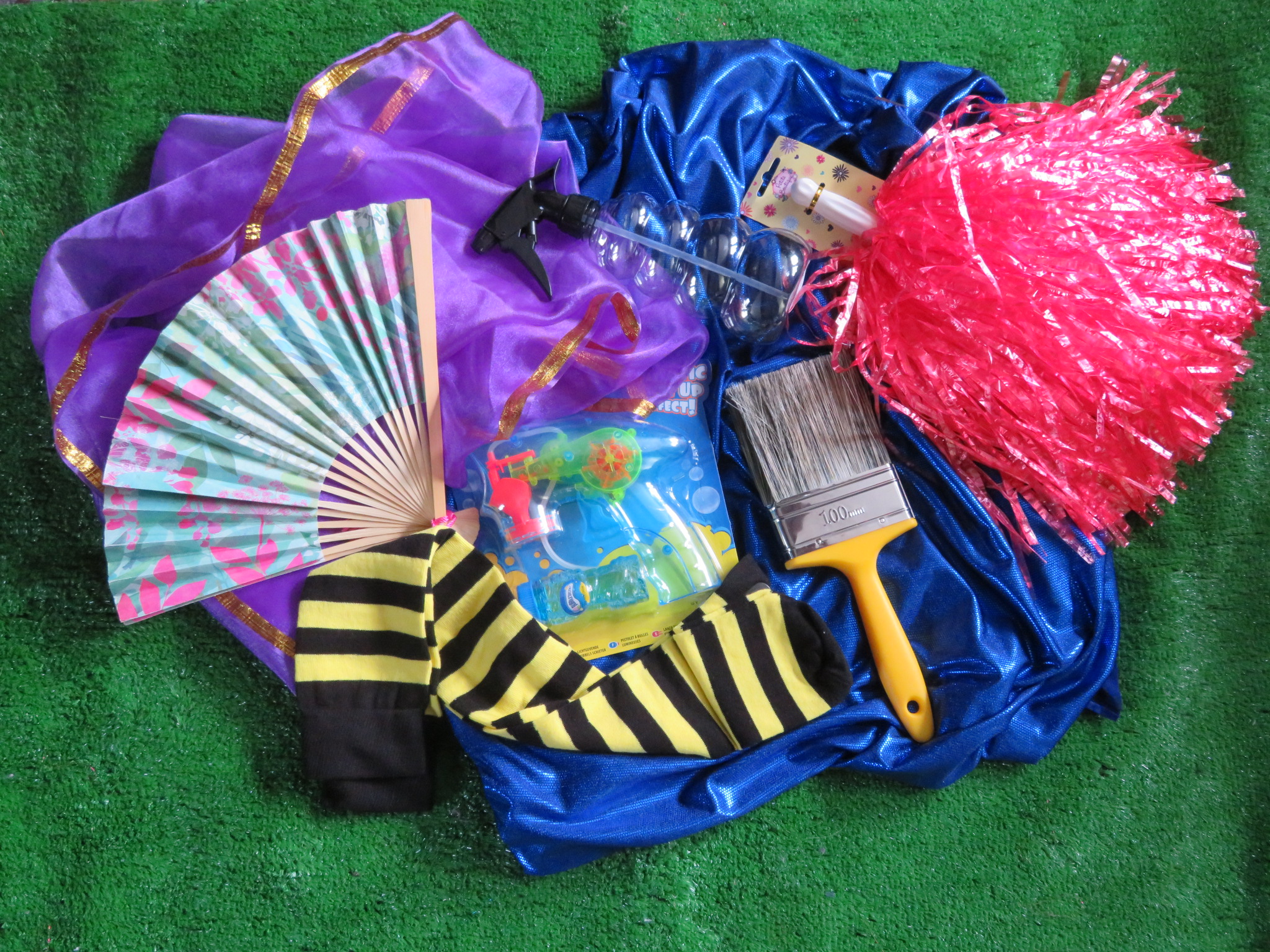 photo of the crafty and playfun object such as cheerleading pom pom and a paint brush