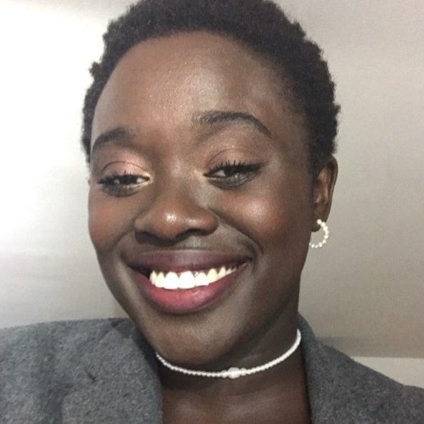 Portrait of Gabi a black woman with short hair.