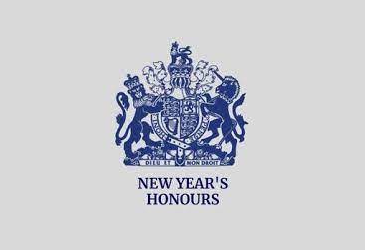 Image is the logo for the New Year's Honours list. It says New Year's Honours underneath British Royal Coat of Arms.