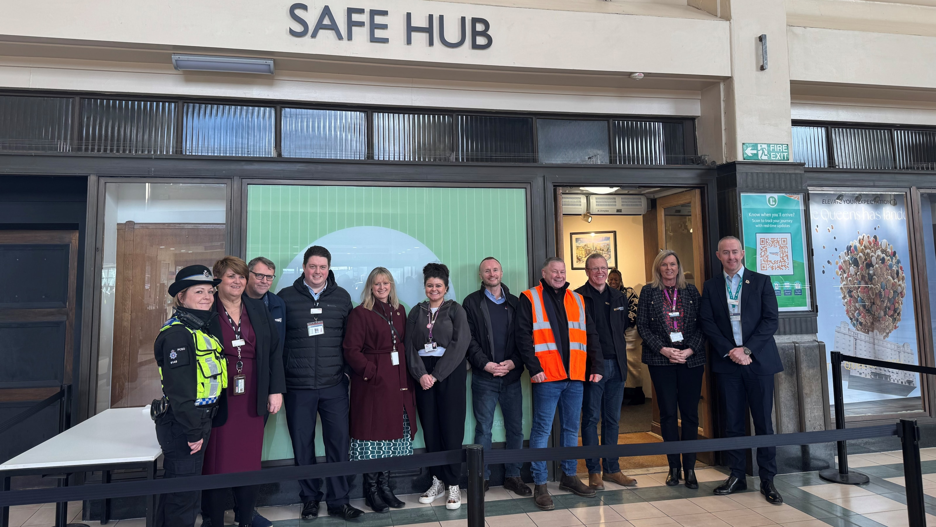The team stood outside the train station office.